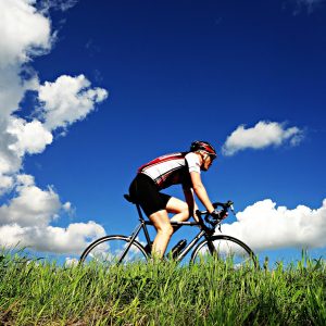 cyclist blue sky
